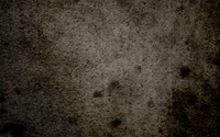 Texture de mur sombre en grunge avec des tons bruns