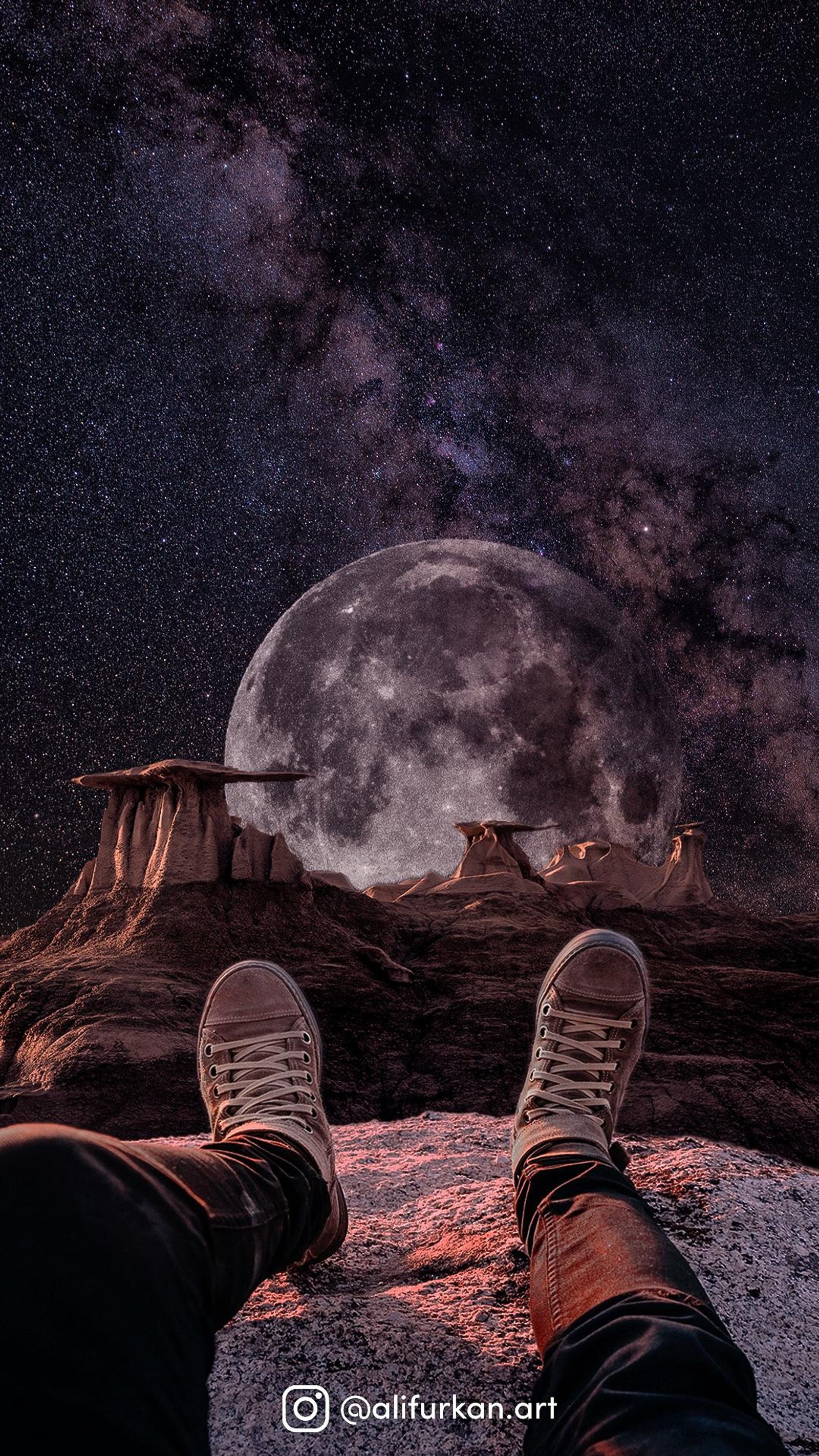 Alguien sentado en una roca con los pies arriba mirando la luna (planeta, espacio)