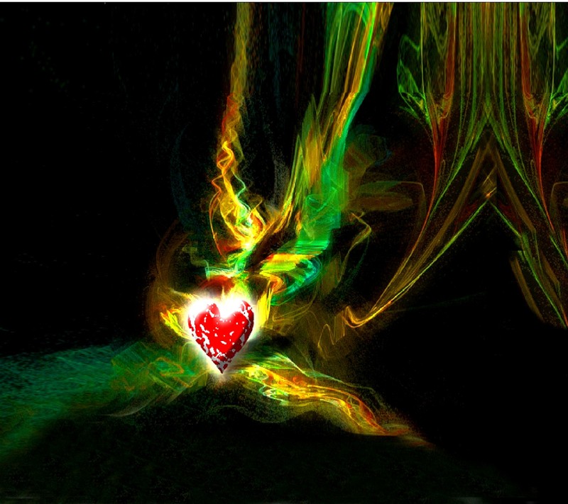 Яркая фотография сердца с красным центром, окруженная зеленым и красным дымом (любовь)