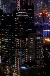 Nighttime Jakarta Cityscape: Skyscrapers and Tower Blocks Illuminated