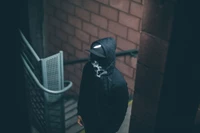 Shadowed Figure in a Dimly Lit Stairwell