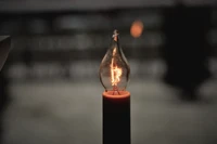 Vintage Incandescent Bulb Illuminating a Dark Space