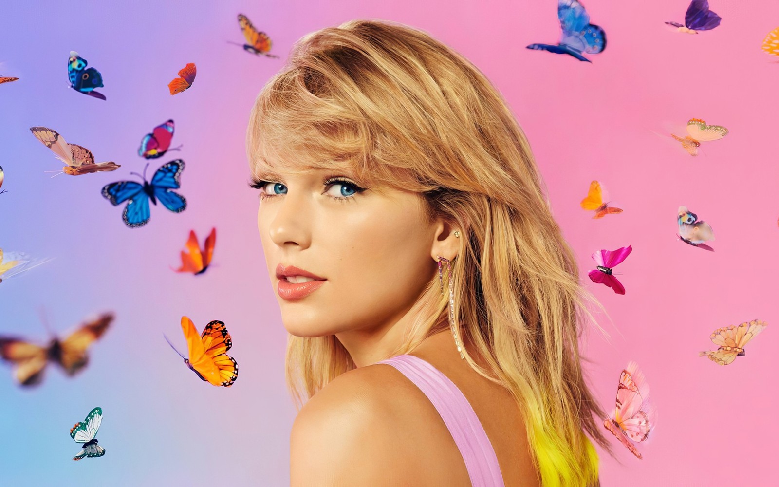 A woman with blonde hair and blue eyes surrounded by butterflies (taylor swift, butterflies, singer, music, 4k wallpaper)