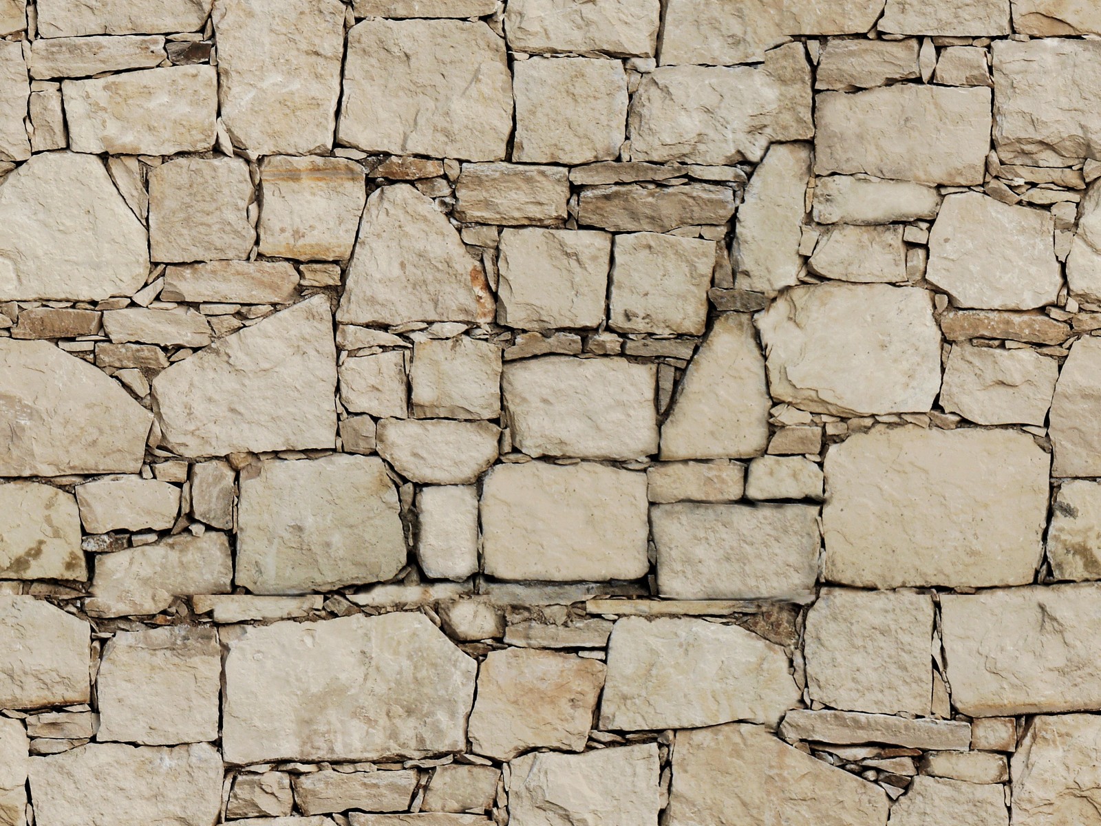 A close up of a stone wall with a fire hydrant in the middle (stone wall, wall, rock, pattern, limestone)