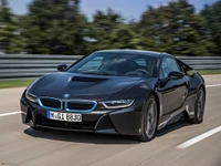 2015 BMW i8: A sleek, futuristic sports car showcasing cutting-edge design and performance on the road.