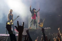 Guns N' Roses electrifies the stage in San Diego, delivering a powerful performance of rock anthems amidst a sea of enthusiastic fans.