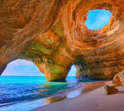 Stunning Coastal Cave with Vibrant Blue Waters and Unique Rock Formations