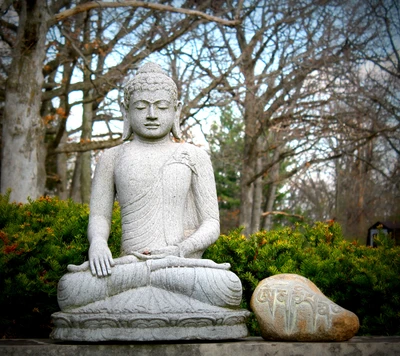 Serene Buddha Statue in Meditation Amidst Nature