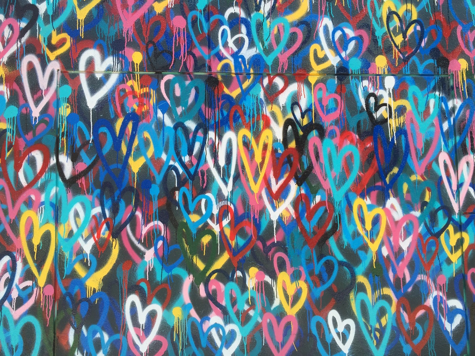 Graffiti on a wall with a bunch of hearts painted on it (romance, pattern, psychedelic art, visual arts, art)