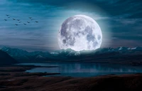 Majestic Full Moon Over Tranquil Lake and Mountain Landscape