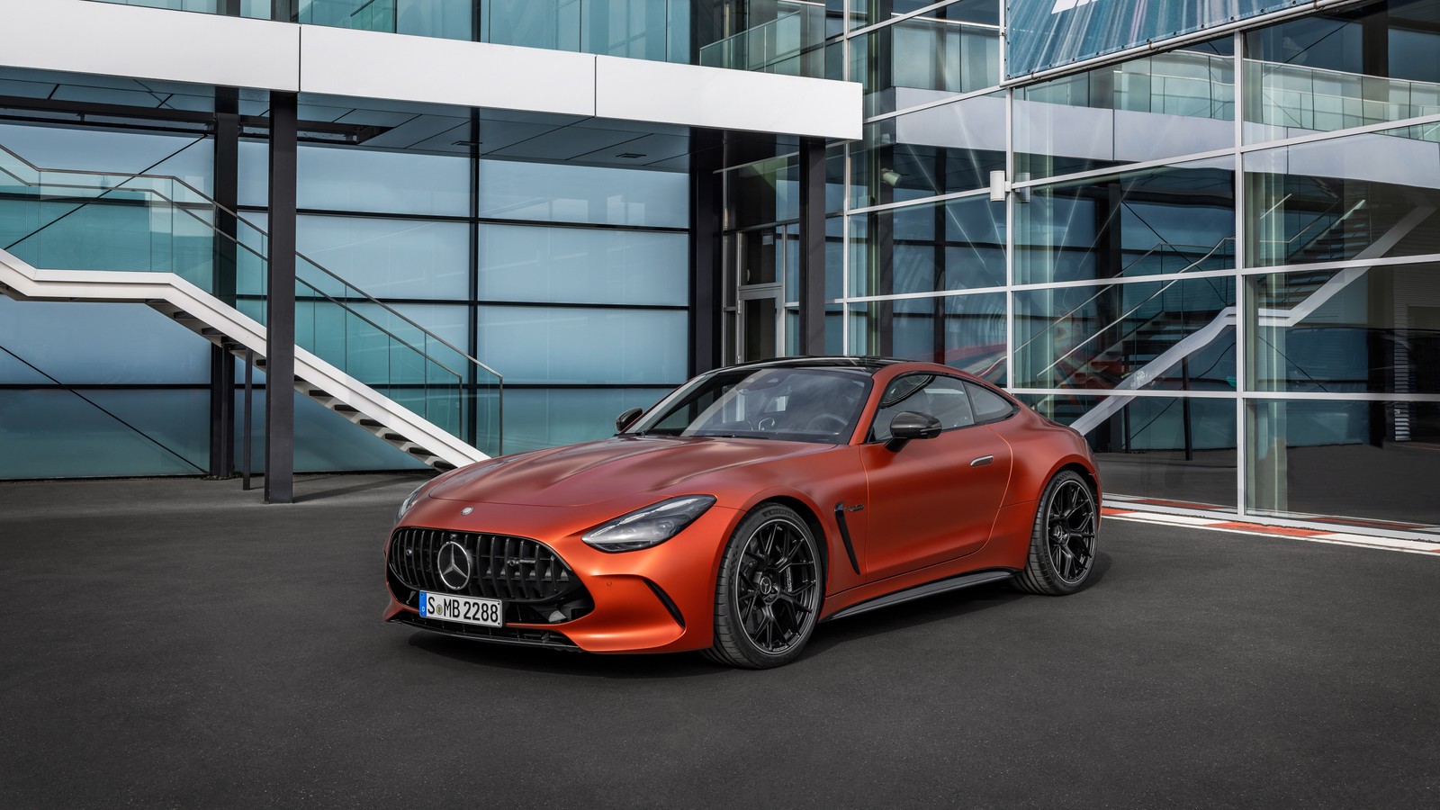 The mercedes amg gt roads coupe is shown in front of a glass building (mercedes amg gt 63 s e performance, 5k, cars, 4k wallpaper)