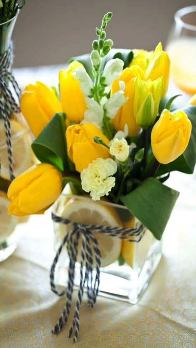 Vibrant Yellow Tulips in a Clear Glass Vase