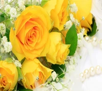 Beautiful Yellow Roses Surrounded by Delicate Flowers and Pearls