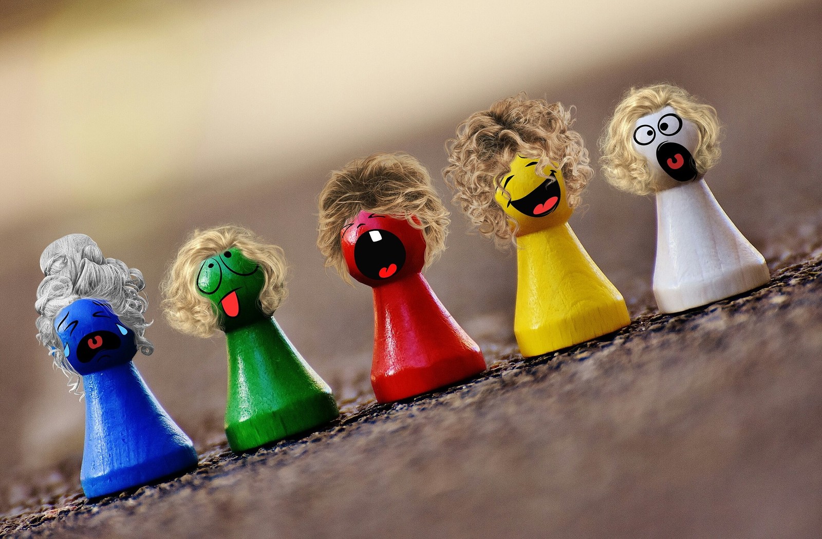 There are five wooden toy figures of different colors and sizes (toy, child, play, festival, game)