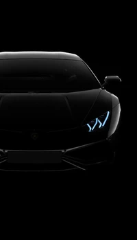 Lujoso Lamborghini negro con faros iluminados