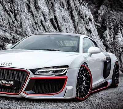 Sleek Audi R8 with Red Accents Against a Rugged Rocky Backdrop