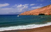 Serene Coastal View with Rocky Promontory and Gentle Waves