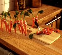 Carrots with Faces in a Kitchen Scene