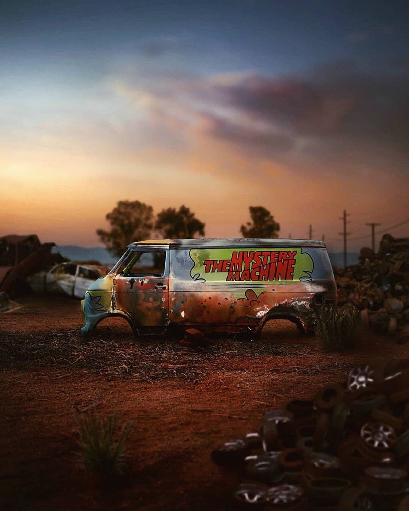 There is a van that is parked in the dirt (scooby doo, scooby, doo, mistery machine, mistery)