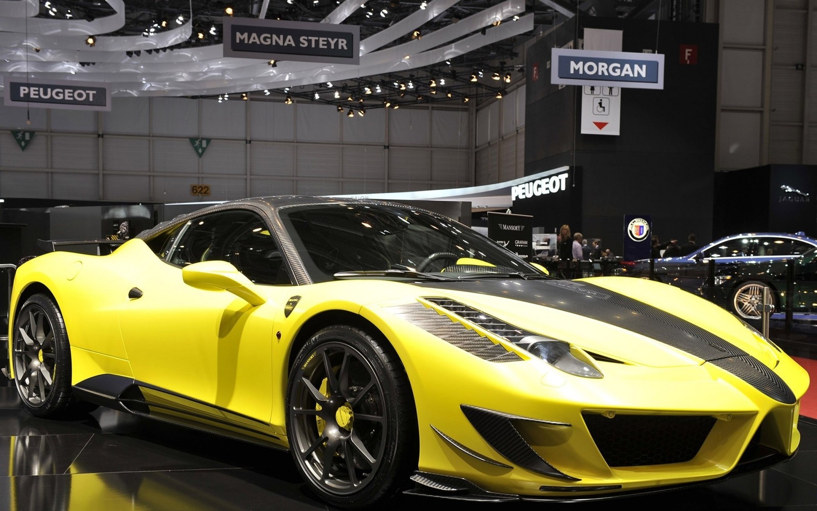 A close up of a yellow sports car on display at a show (geneva motor show, ferrari 458, supercar, land vehicle, motor vehicle)