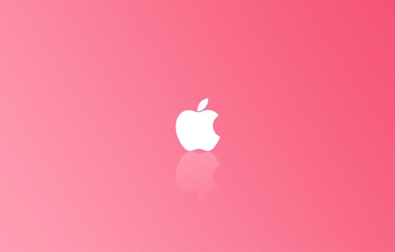 Logo de apple sobre fondo rosa (manzana, macbook, rosa, rojo, corazón)