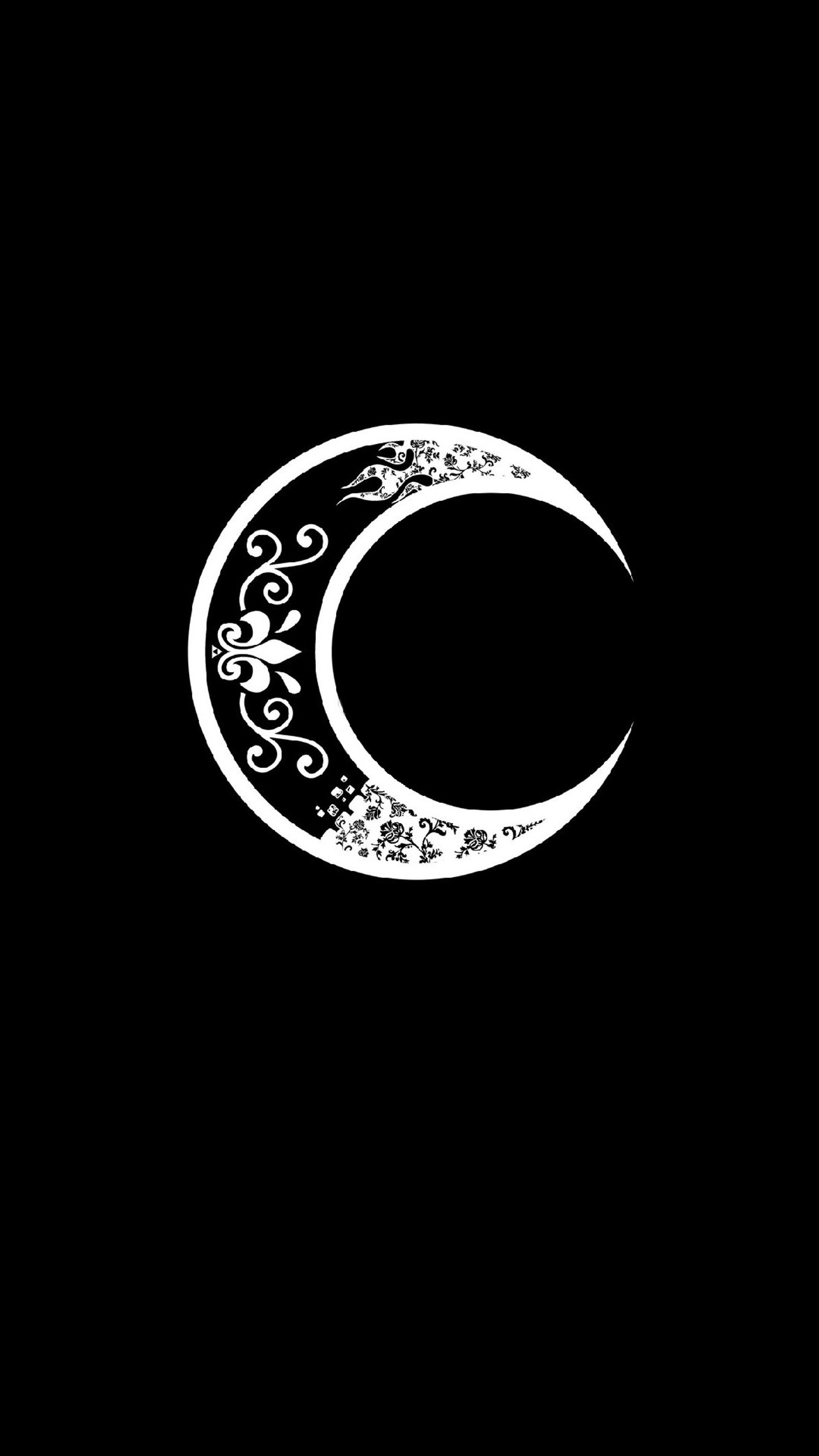 A close up of a black and white moon with a swirly design (crescent, moon, night)