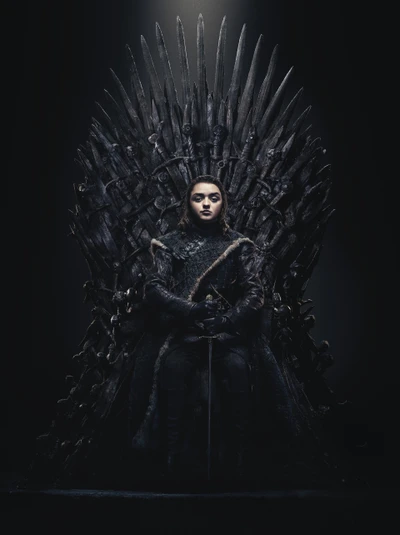 Arya Stark en el Trono de Hierro, exudando poder y determinación.