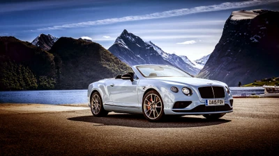 Bentley Continental GTC: Un convertible lujoso en medio de un paisaje montañoso impresionante.