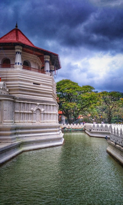 Serene Temple Reflection Under Dramatic Skies