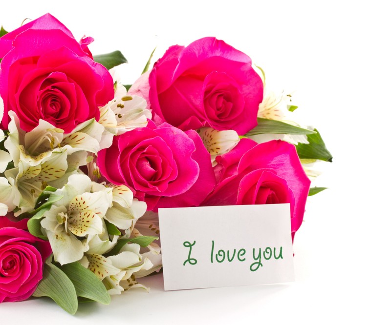 Blumen und eine notiz mit den worten „ich liebe dich“ darauf (rosa, rose)