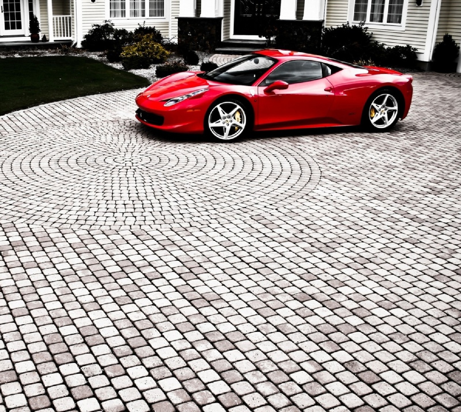 Arafed red sports car parked in front of a white house (ferrari, super car)