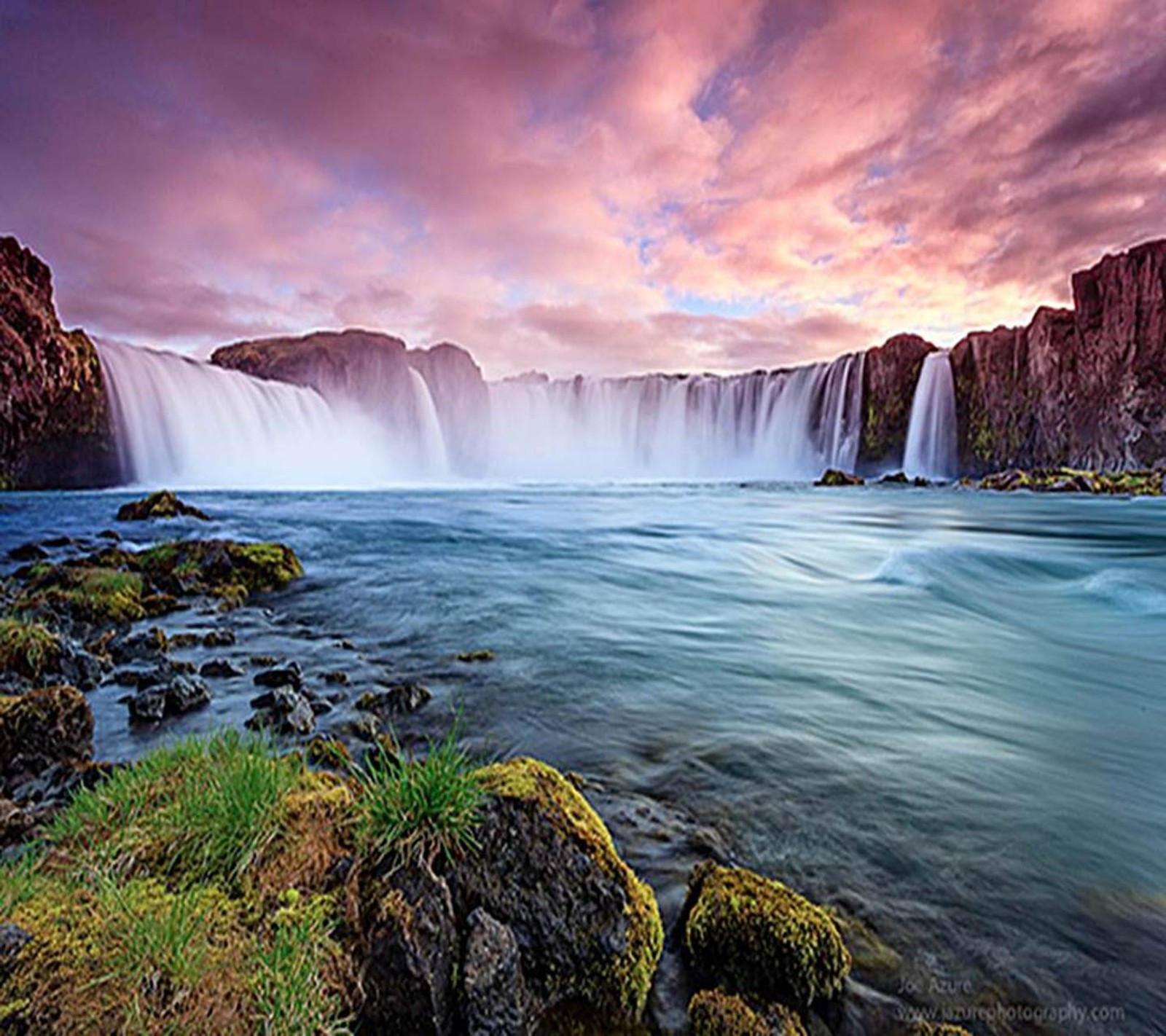 A view of a waterfall with a rainbow colored sky in the background (3d nature, colours, cool, hd nature, hd waterfall)