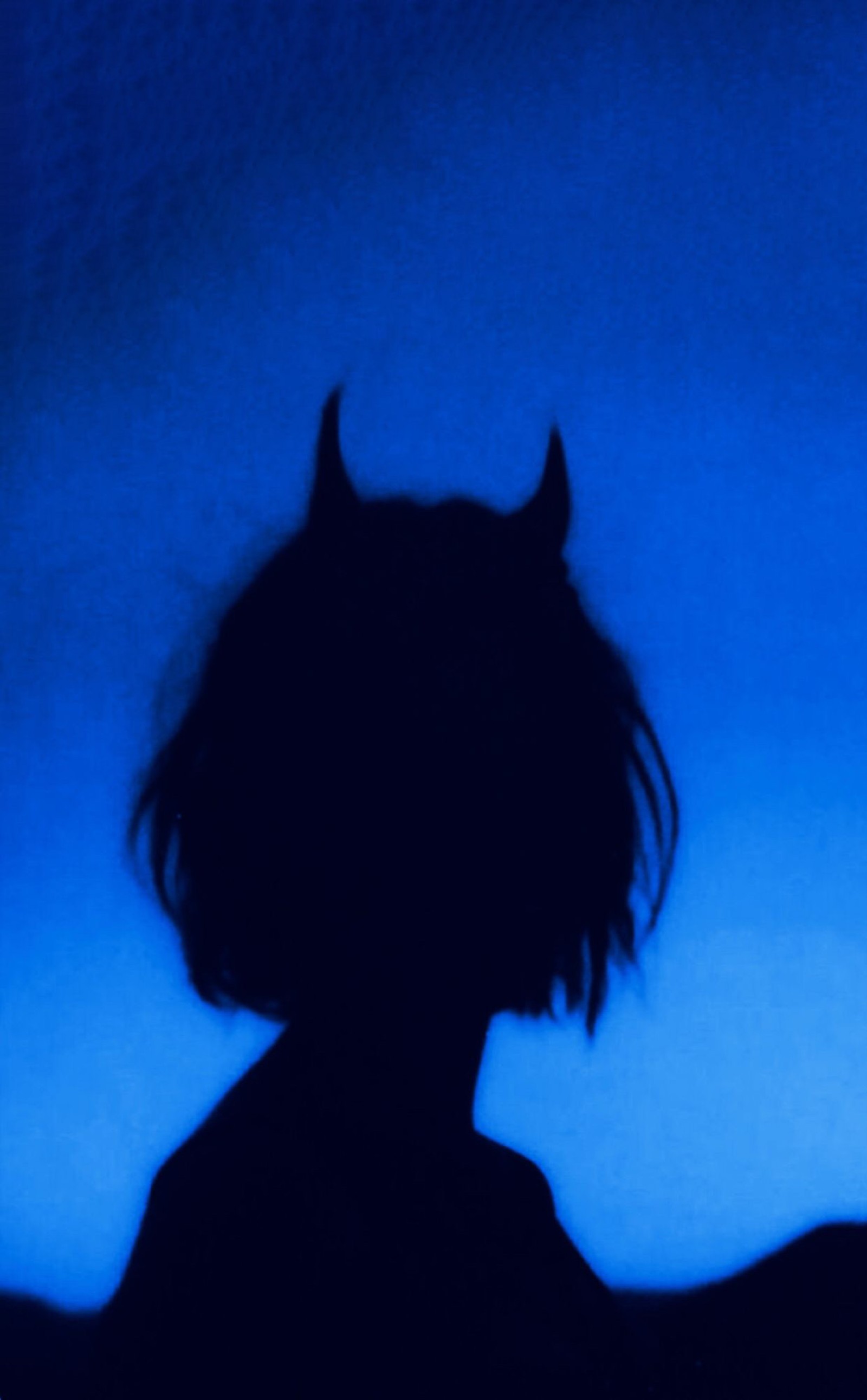 There is a silhouette of a person with a cat ears on (aesthetic, blue, demon, devil, girl)