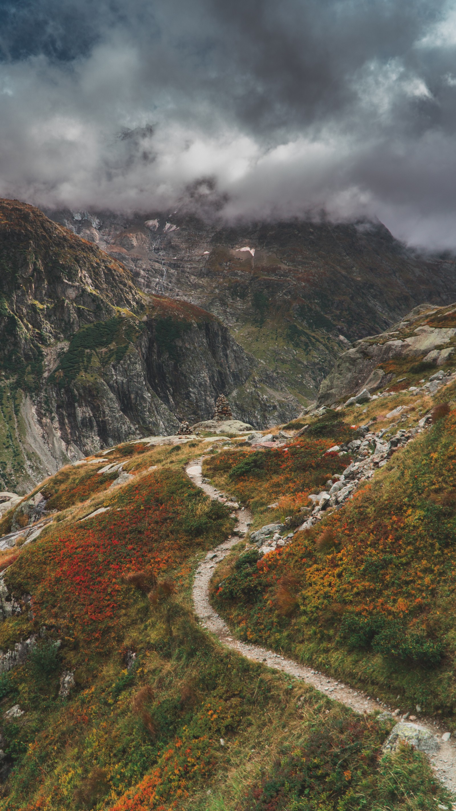 There is a path going up a hill with a mountain in the background (mountainous landforms, highland, nature, mountain, natural landscape)