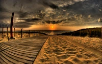 Golden Sunset Over Sandy Shoreline