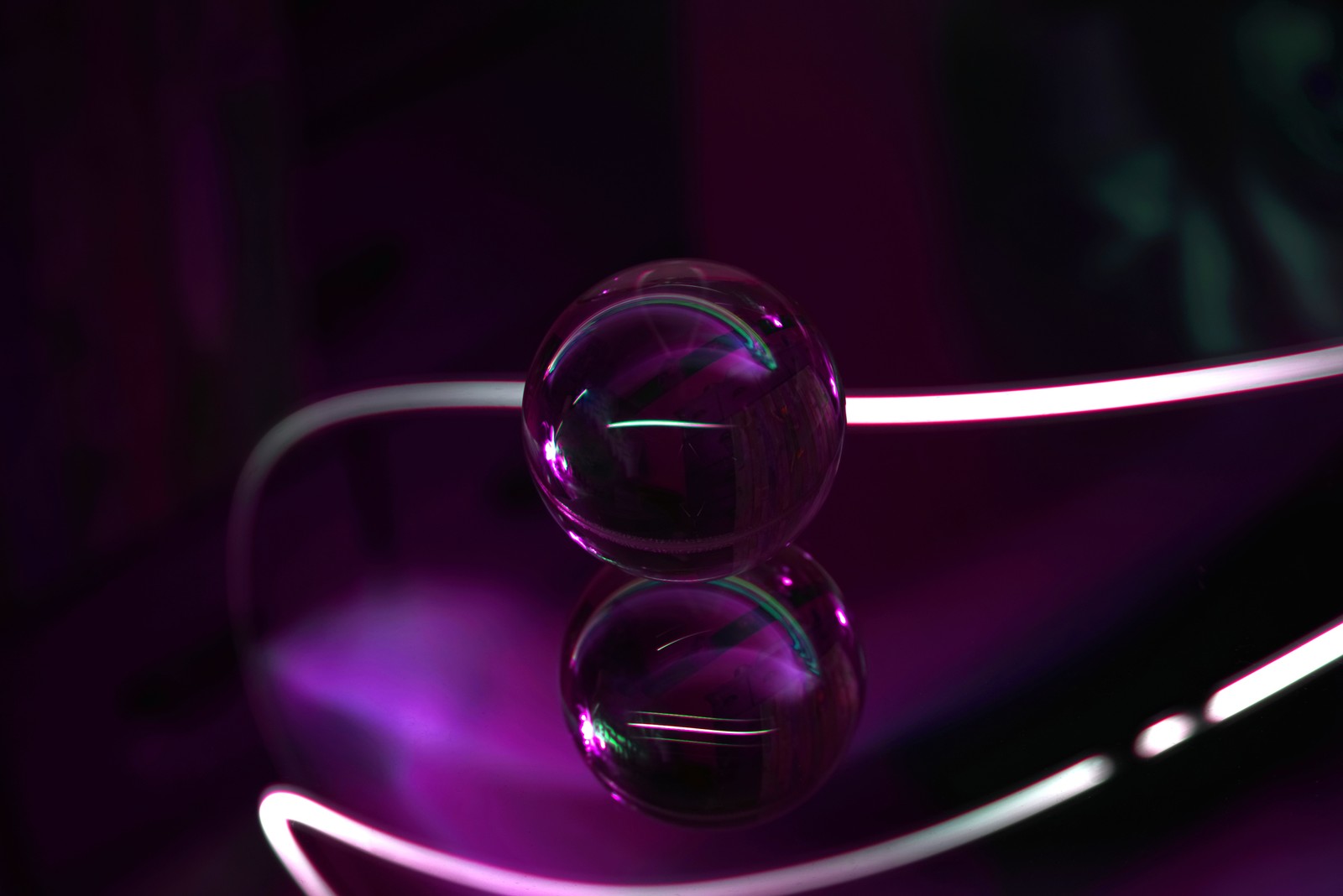 Purple glass spheres are sitting on a purple table (video, magenta, music, glass, purple)