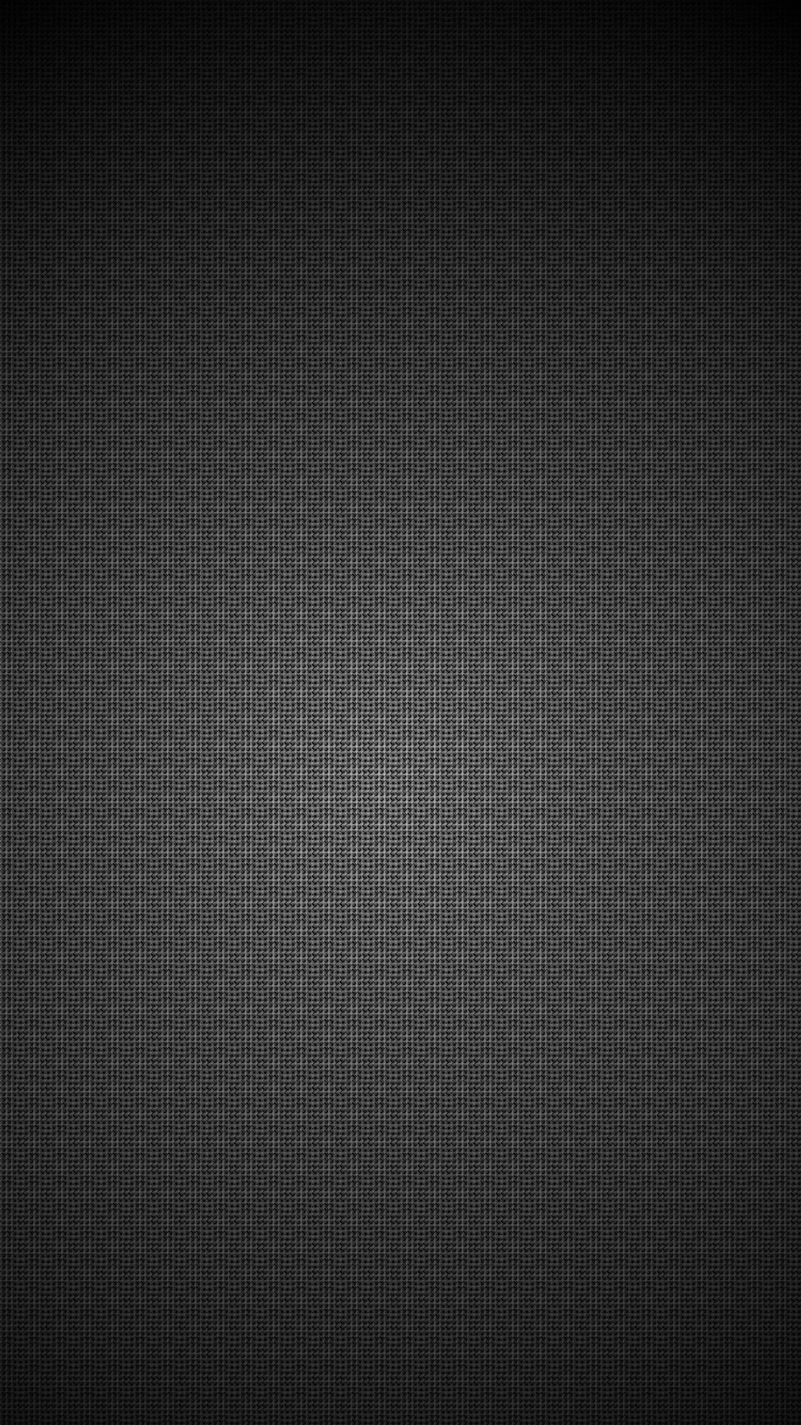 A black background with a pattern of small squares (abstract, texture)