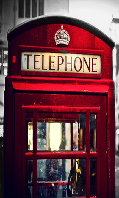 Iconic Red Telephone Booth in London Landscape