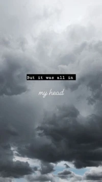 But it was all in my head" - A cloudy sky with introspective lyrics.