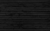 Texture de mur en planches de bois noir monochrome