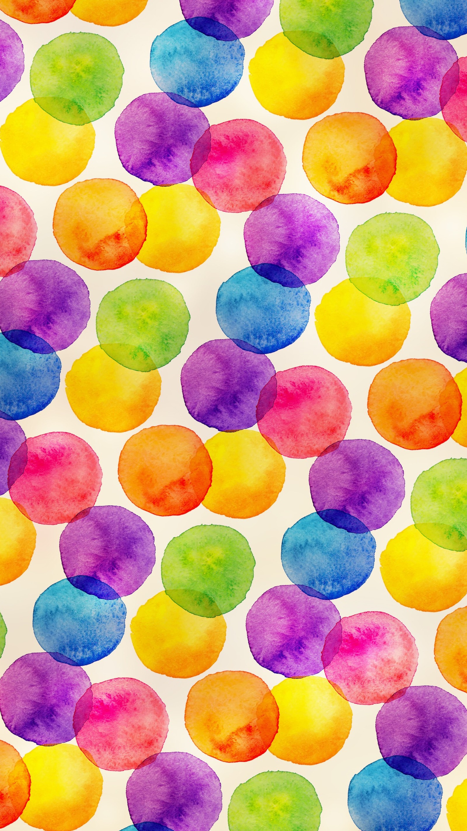 A close up of a colorful watercolor painted background with circles (seeing, spots)