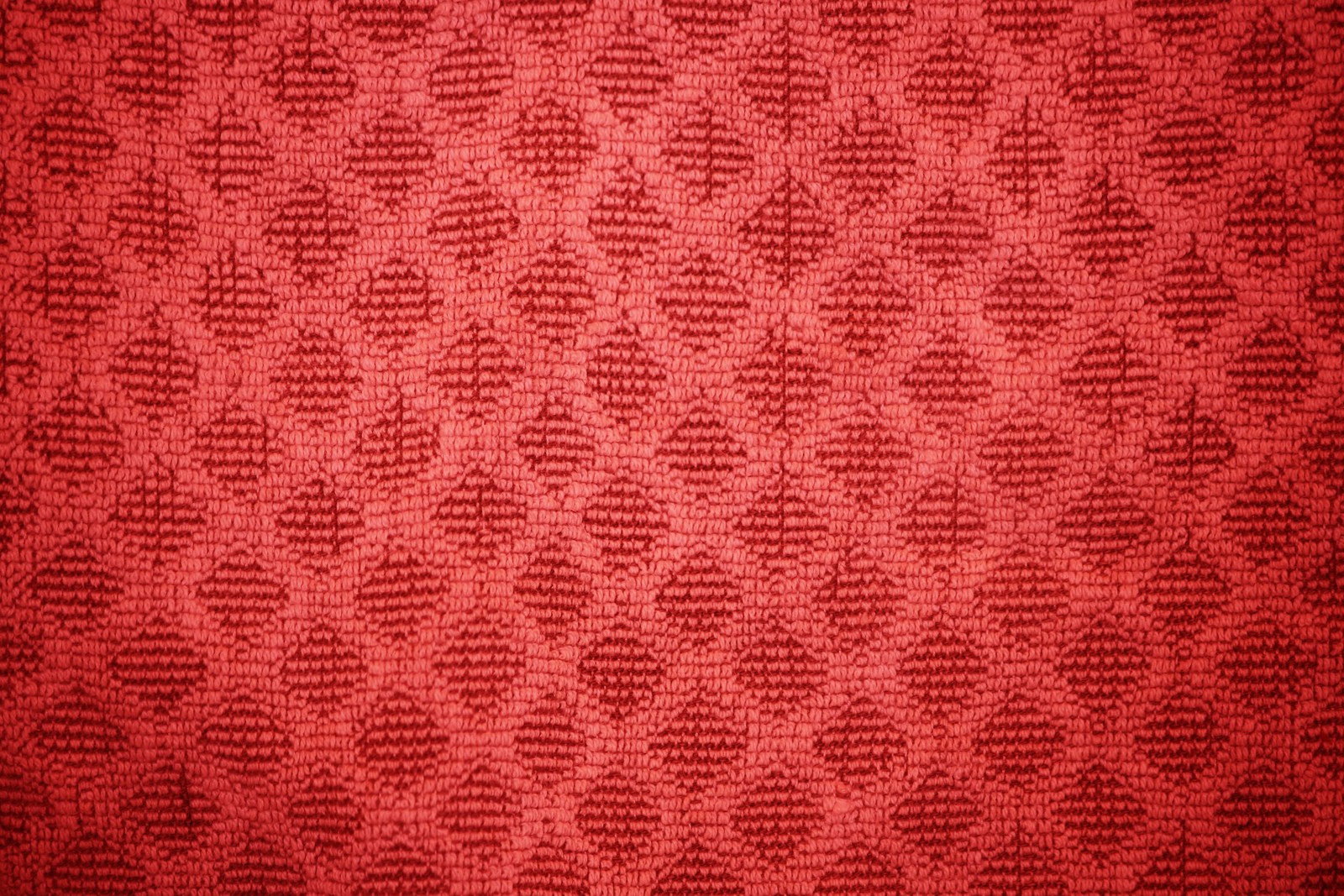 Un fond rouge avec un motif de petits cercles (serviette, motif, texture, textile, tissu tissé)