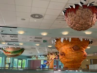 Whimsical Ceiling Sculptures in a Vibrant Lobby Design