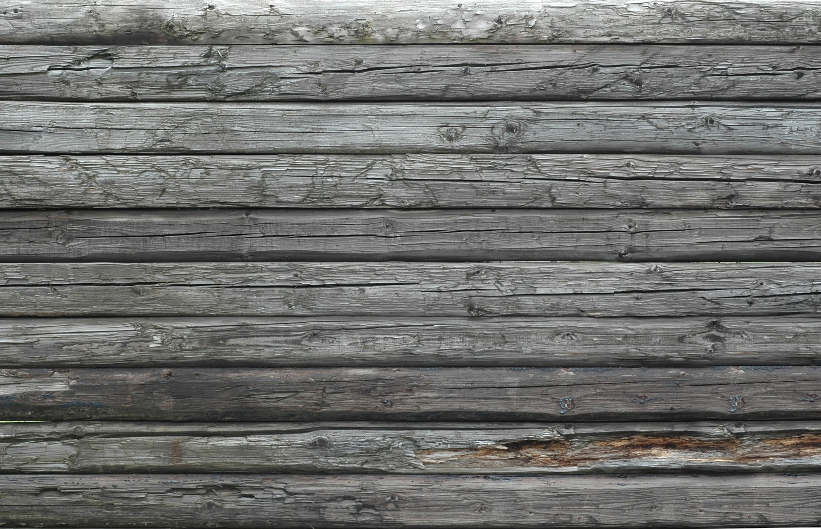 A close up of a wooden wall with a hole in it (wall, texture mapping, wood, lumber, plank)