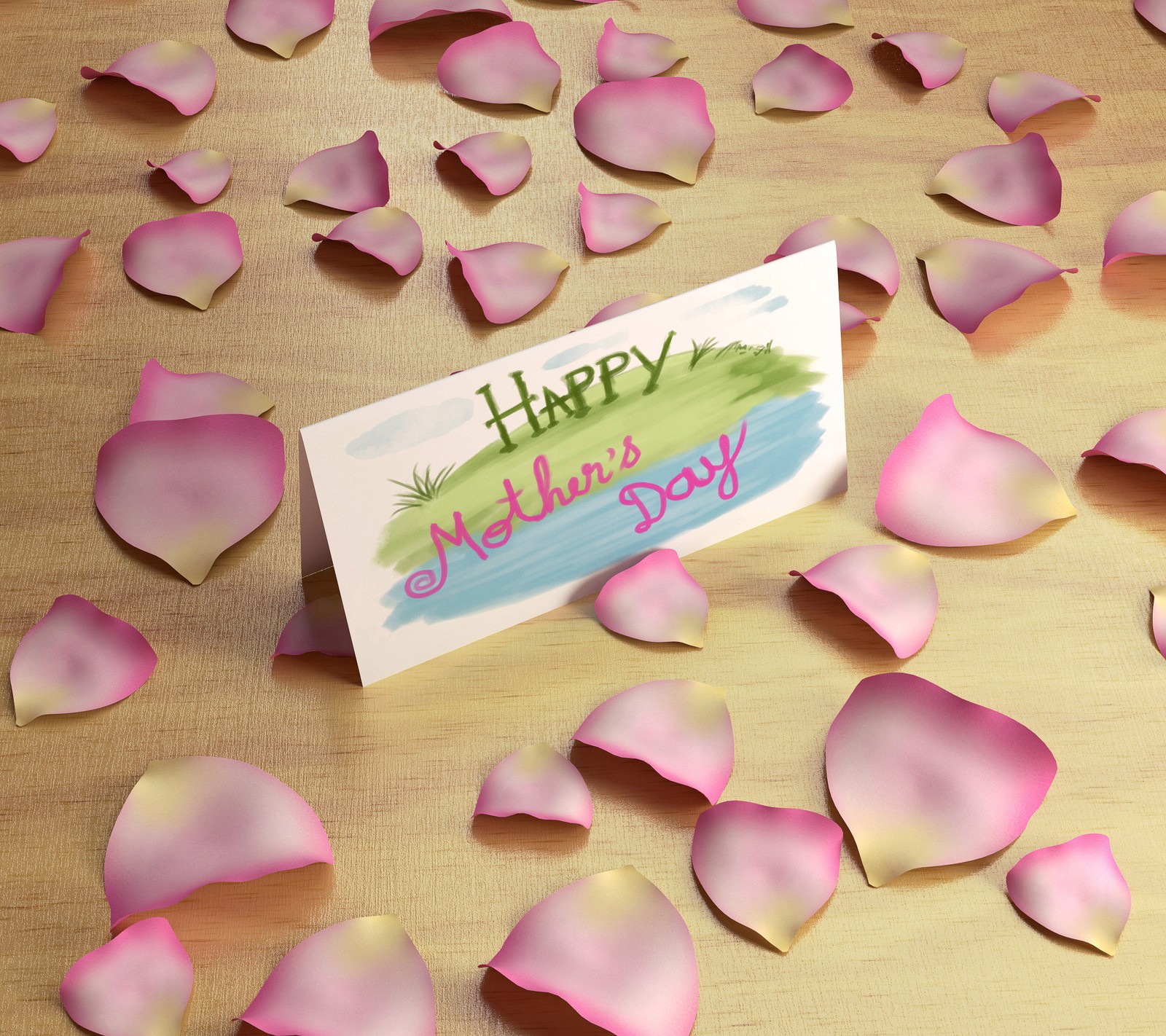 There is a card with a message on it surrounded by petals (day, family, love, mom, momma)