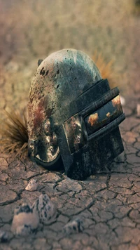 Casco oxidado en suelo agrietado: un fondo de pantalla inspirado en PUBG