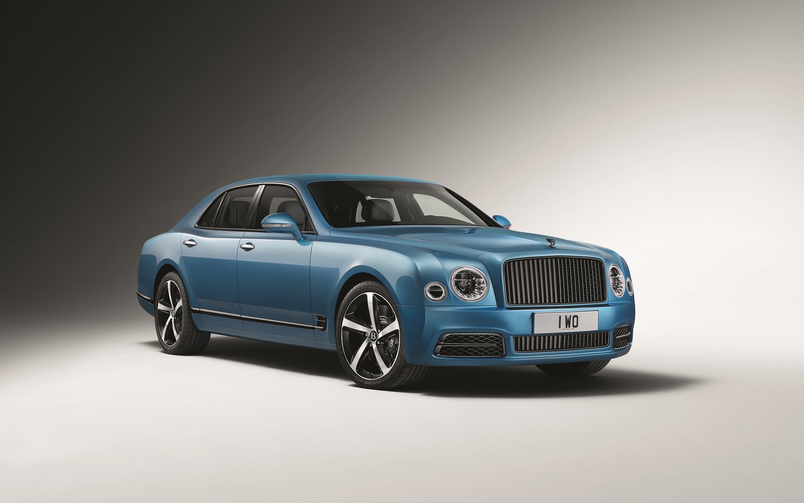 A blue bentley mulspeed is shown in a studio (bentley motors limited, bentley, car, wheel, speed)