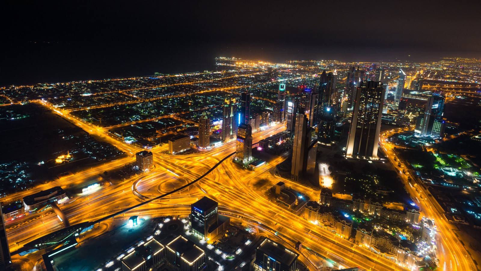 A view of a city at night from the top of a skyscraper (burj khalifa, cityscape, city, urban area, night)