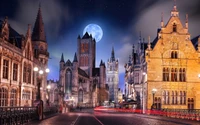 Enchanting Nighttime Cityscape of a Gothic Landmark Under a Full Moon