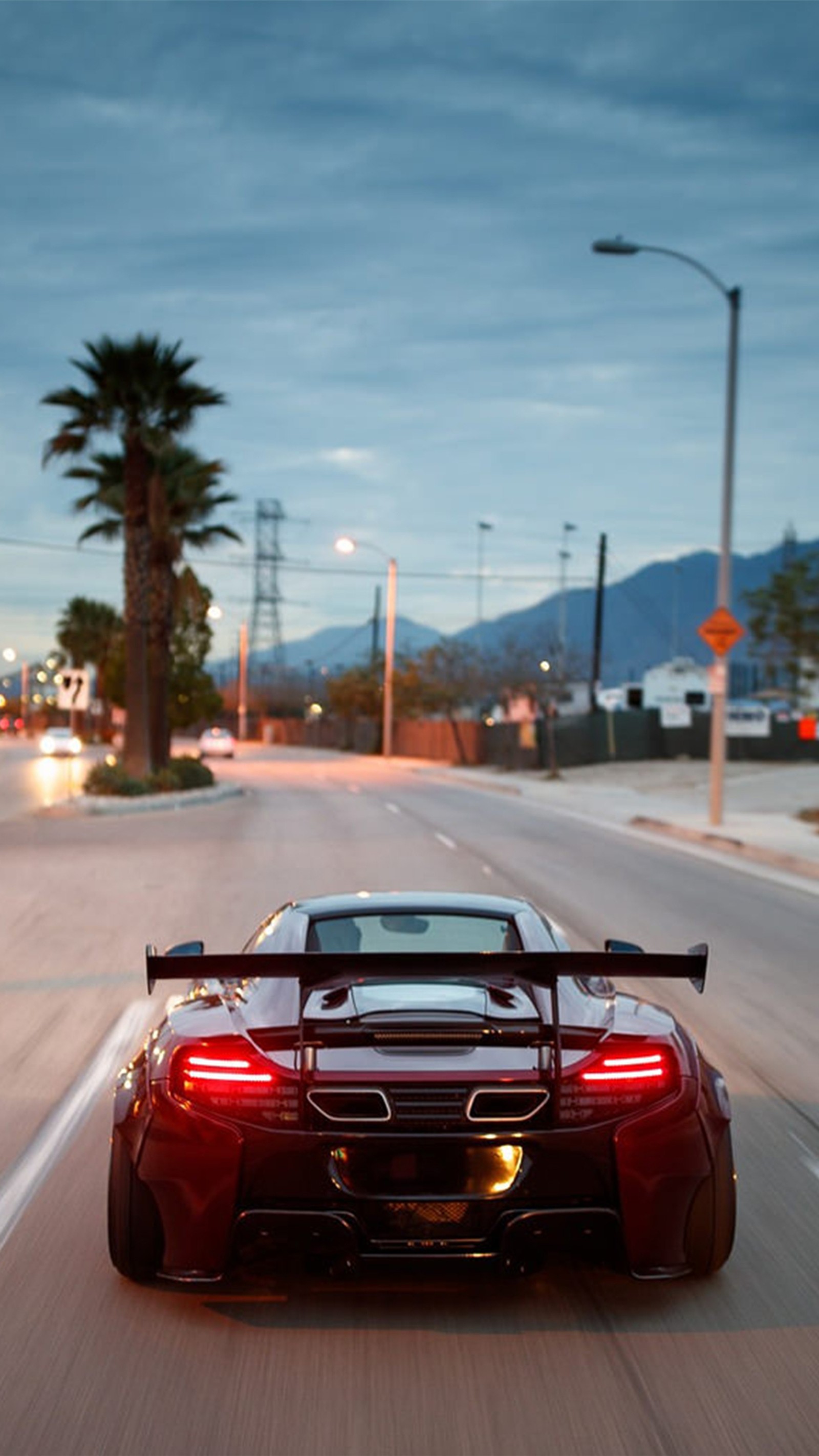 Arafed red sports car driving down a street at night (car, cars, life, natur, need4speed)